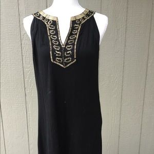 Black dress with gold beading around neck